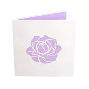 Front Cover of PopLifes Pink Roses Bouquet Card Has Laser Cut Purple Rose Outlines To Show Image of Inside