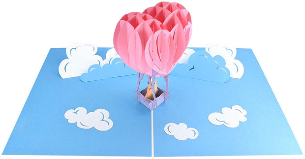 PopLife Pop-Up card complete with blue sky and fluffy white clouds backdrop