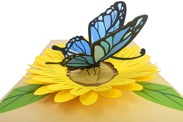 Features blue butterfly in a yellow sunflower