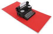 PopLife pop-up card features mechanical typewriter with "I love you so much." message on paper