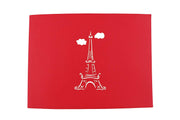 Front cover of card with red color features Eifel Towel and clouds 