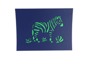 Front cover of card with blue color features zebra and grasses