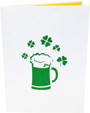 Front cover of card with light grey color features beer mug and clover leaves