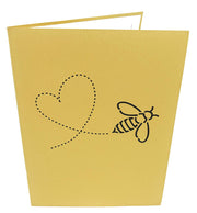 7.5 inches by 6 inches brown card with a heart and bee cutout