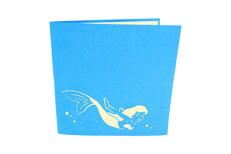 6 inches by 6 inches blue card with a swimming mermaid cutout