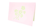Front cover of card with pink color features cherry blossom flower