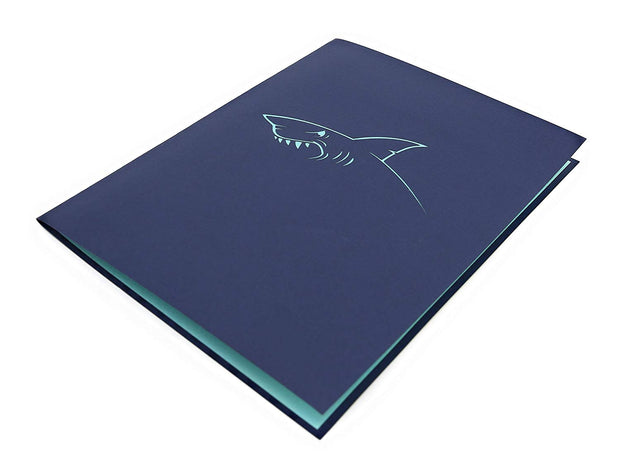 Front cover of card with blue color features shark's jaws design