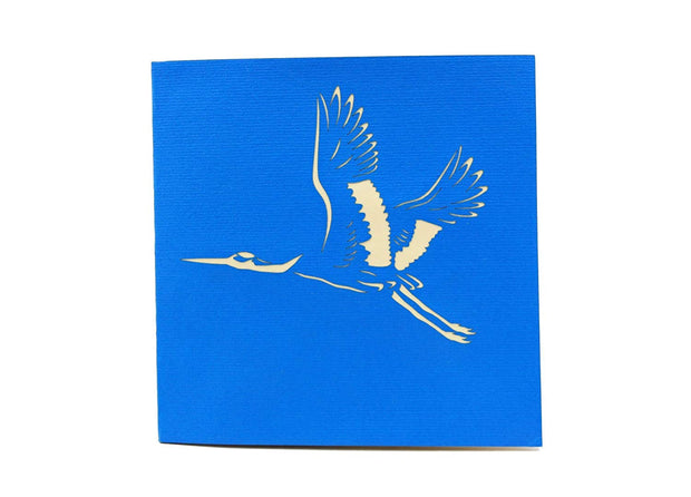 Front cover of card with blue color features flying crane bird
