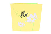 Front cover of card with yellow color features honey bee and flowers