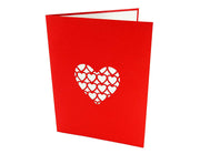 Front cover of card with red color features hearts design
