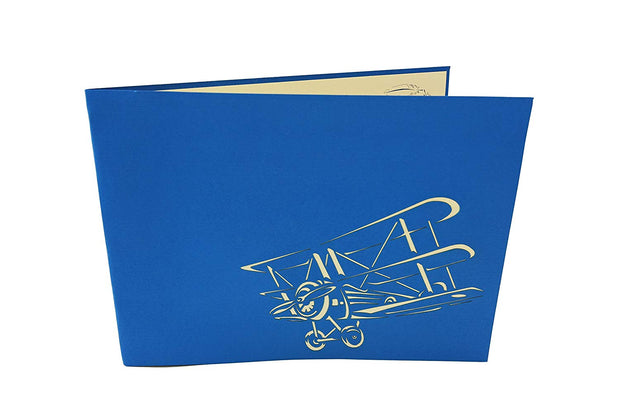 Front cover of card with blue color features flying bi-plane
