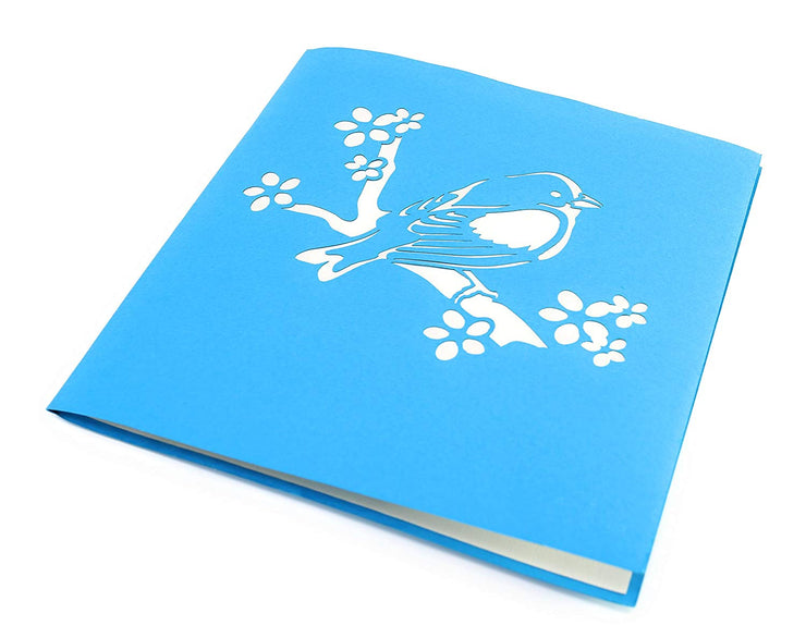 Front cover of card with blue color features bird on a branch 