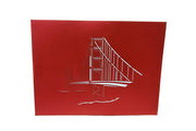 Front cover of card with red color features Golden Gate Bridge design